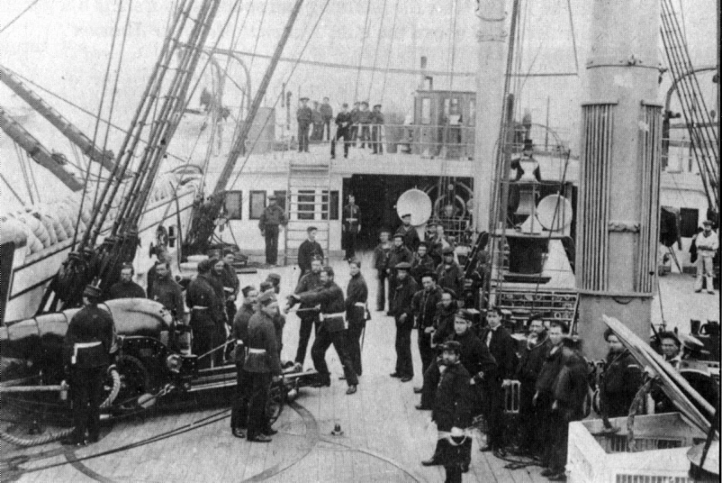 Photograph showing deck of the British broadside ironclad HMS Minotaur (1863). A 7-inch muzzle-loading rifle on a wrought iron gun carriage is at lower left.  Unattributed, assumed Royal Navy